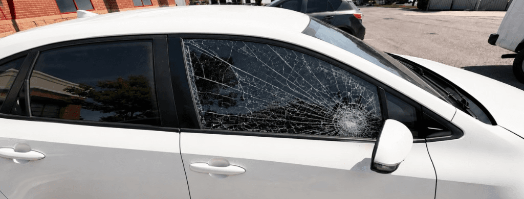 Shattered door glass before Summit Auto Glass replacement